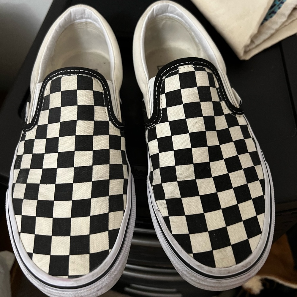 Checkered Vans slip ons
